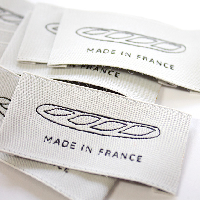 Premium logo label in black and white by Nominette